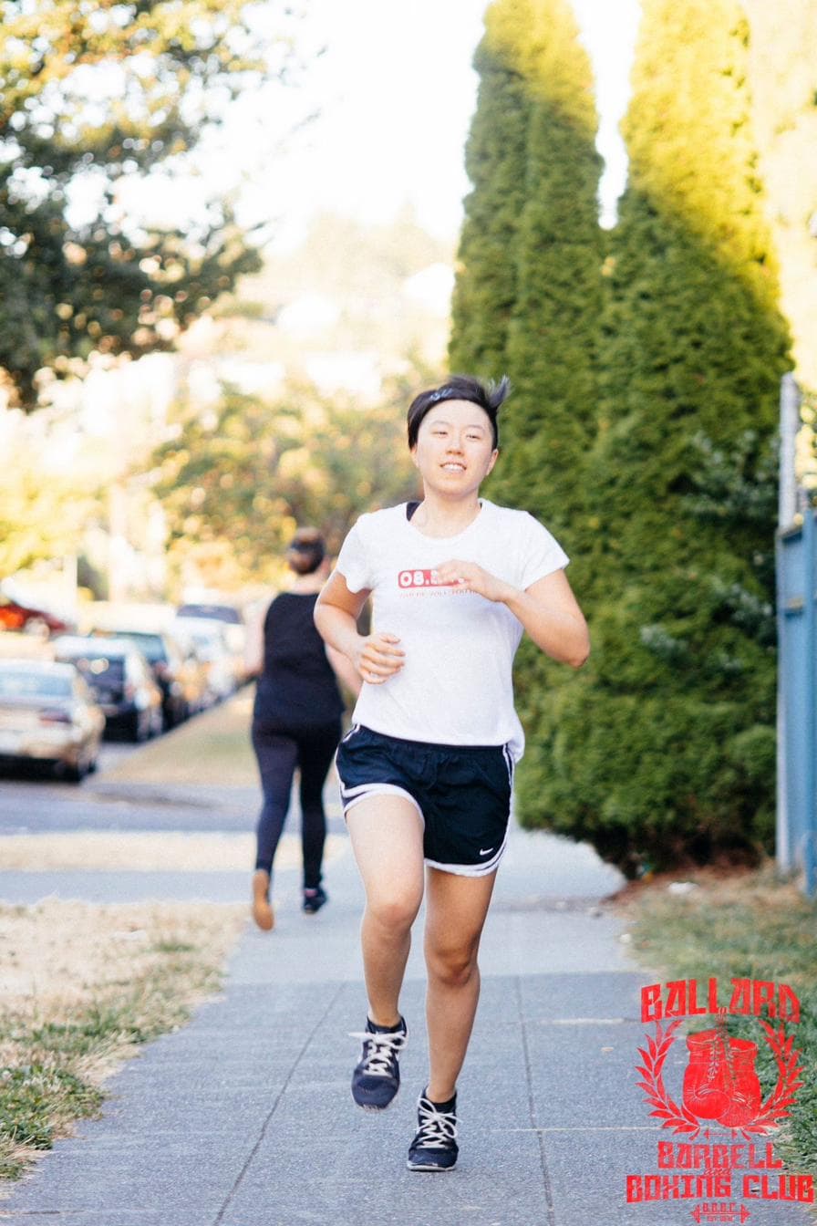 Members of Ballard Barbell and Boxing Club running outdoors in Ballard, Seattle